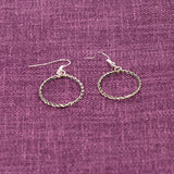 Sterling silver thin twist wire loop earrings. Handmade by Navajo artisan Nashina Tsosie